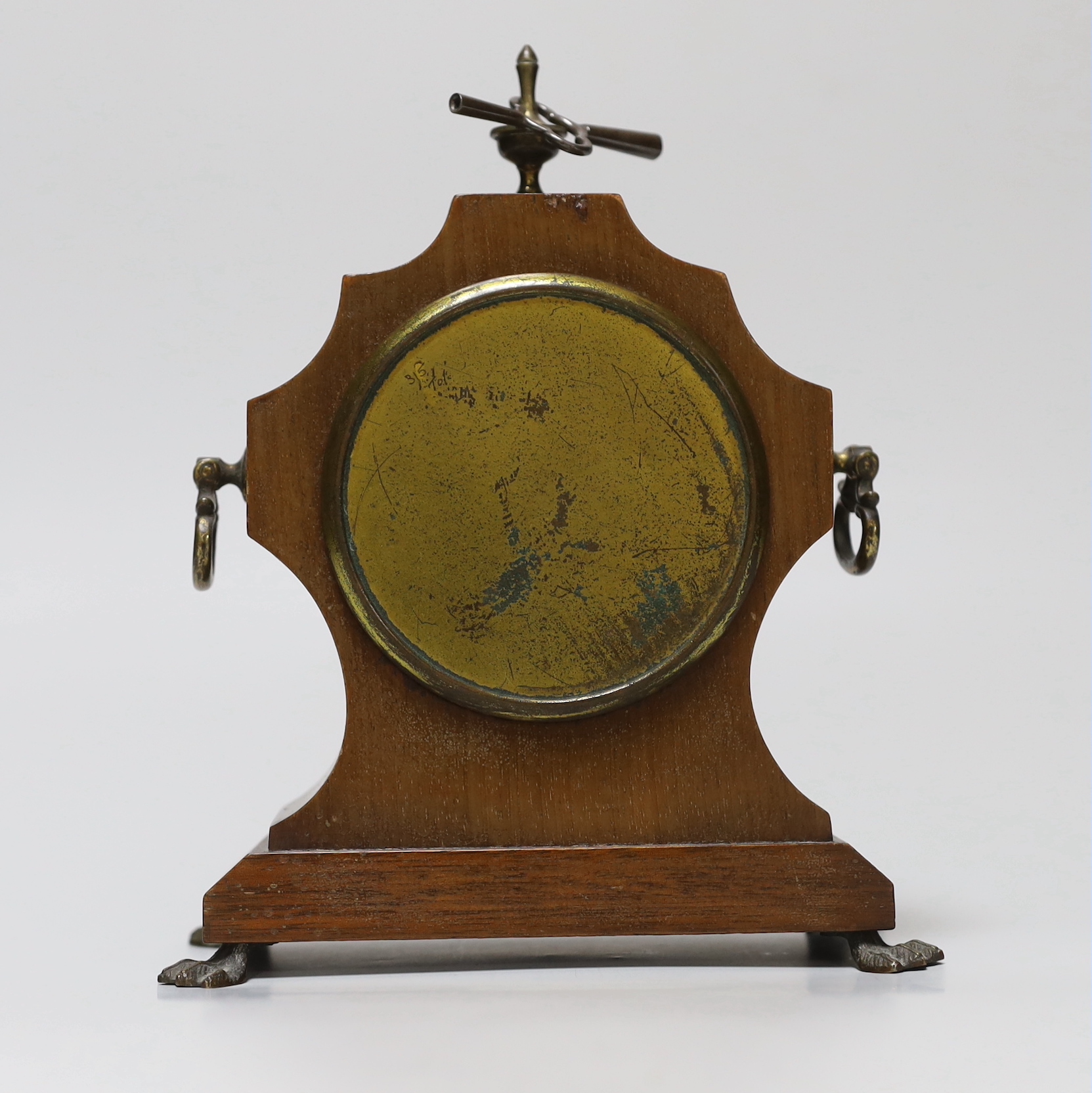 A small mahogany mantel timepiece with key, the dial inscribed B W Fase, 21cm high